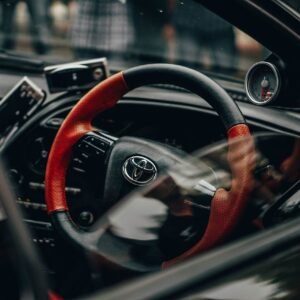 Black and Red Toyota Car Steering Wheel